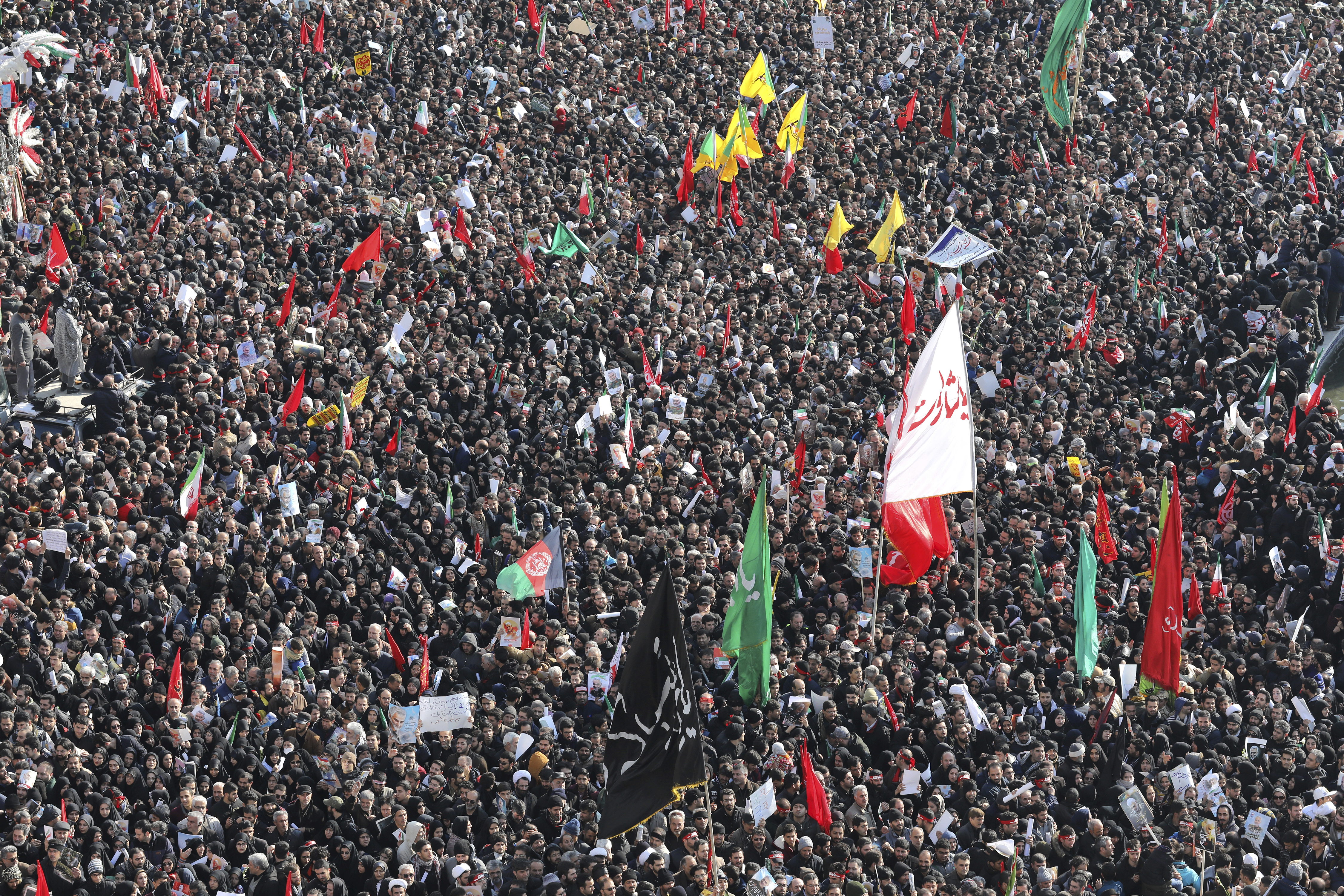 Mourners attend a funeral ceremony for Iranian Gen. Qassem Soleimani and his comrades, who were killed in Iraq in a U.S. drone strike on Friday, at the Enqelab-e-Eslami (Islamic Revolution) square in Tehran, Iran, Monday, Jan. 6, 2020. The processions mark the first time Iran honored a single man with a multi-city ceremony. Not even Ayatollah Ruhollah Khomeini, who founded the Islamic Republic, received such a processional with his death in 1989. Soleimani on Monday will lie in state at Tehran's famed Musalla mosque as the revolutionary leader did before him. (AP Photo/Ebrahim Noroozi)