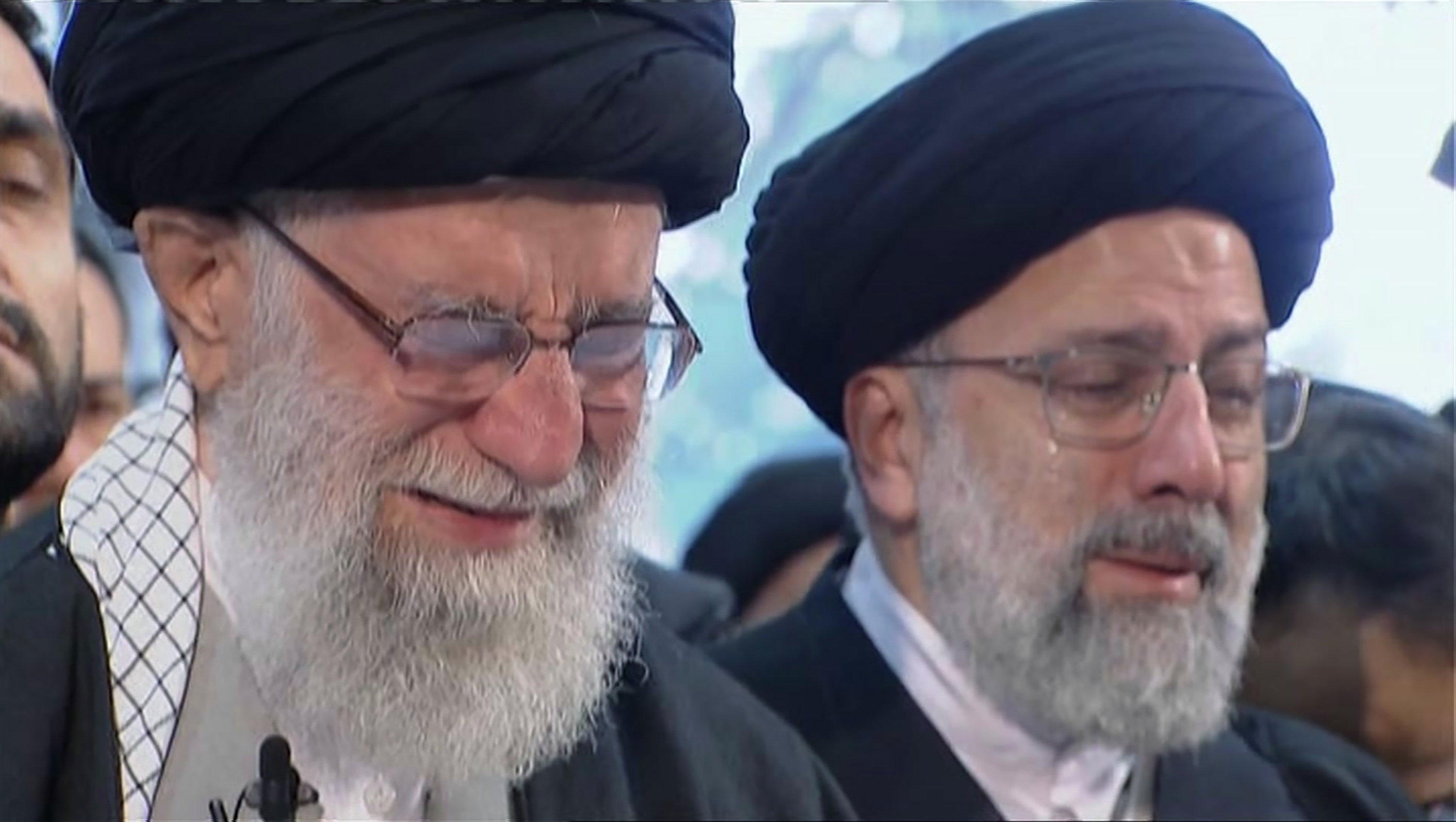 In this image taken from video, Iranian Supreme Leader Ayatollah Ali Khamenei, left, openly weeps as he leads a prayer over the coffin of Gen. Qassem Soleimani, who was killed in Iraq in a U.S. drone strike on Friday, at the Tehran University campus, in Tehran, Iran, Monday, Jan. 6, 2020. (Iran Press TV via AP)