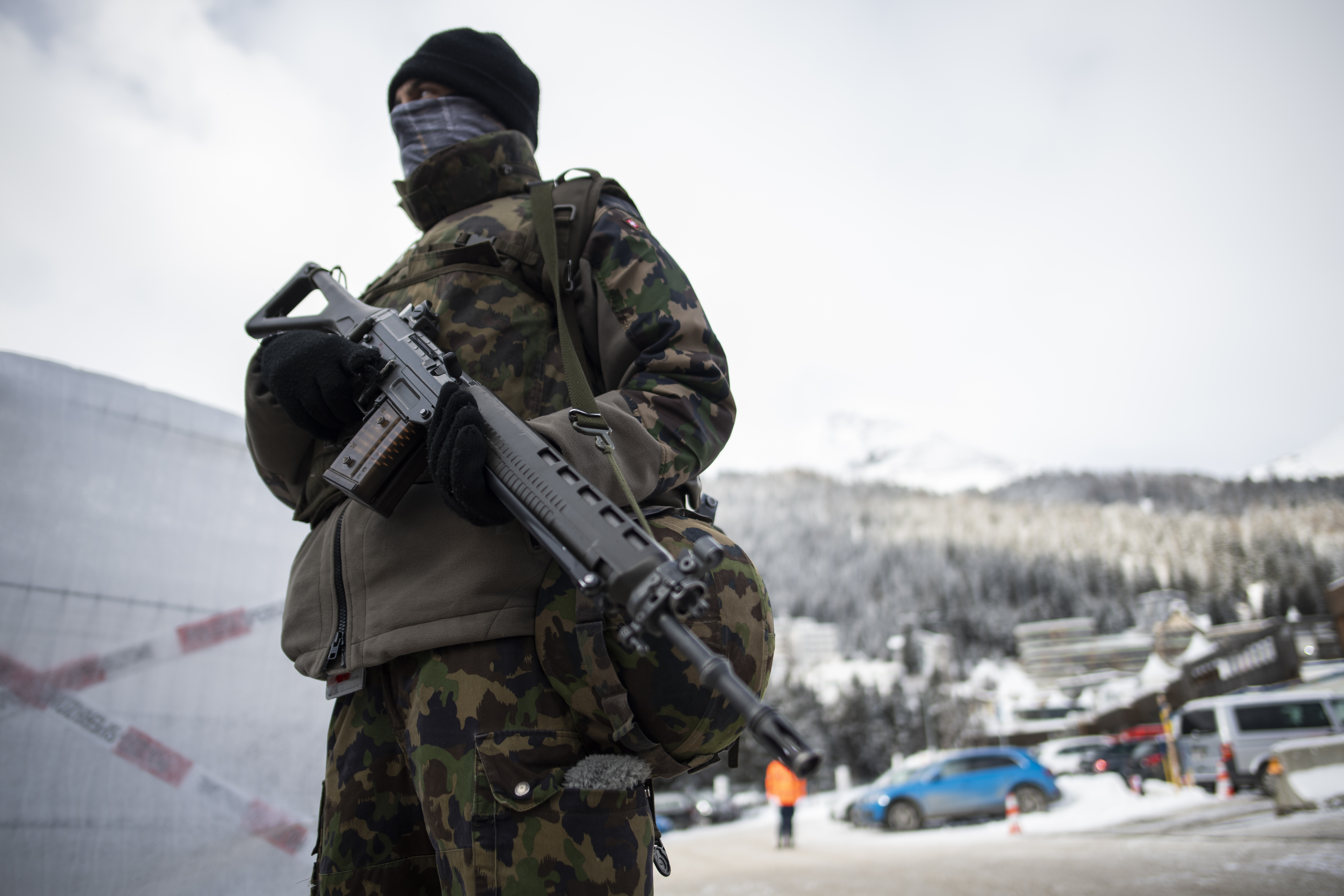 A soldier of the Swiss Army is on guard outside the congress center prior the 50th annual meeting of the World Economic Forum, WEF, in Davos, Switzerland, Sunday, Jan. 19, 2020. (Gian Ehrenzeller/Keystone via AP)