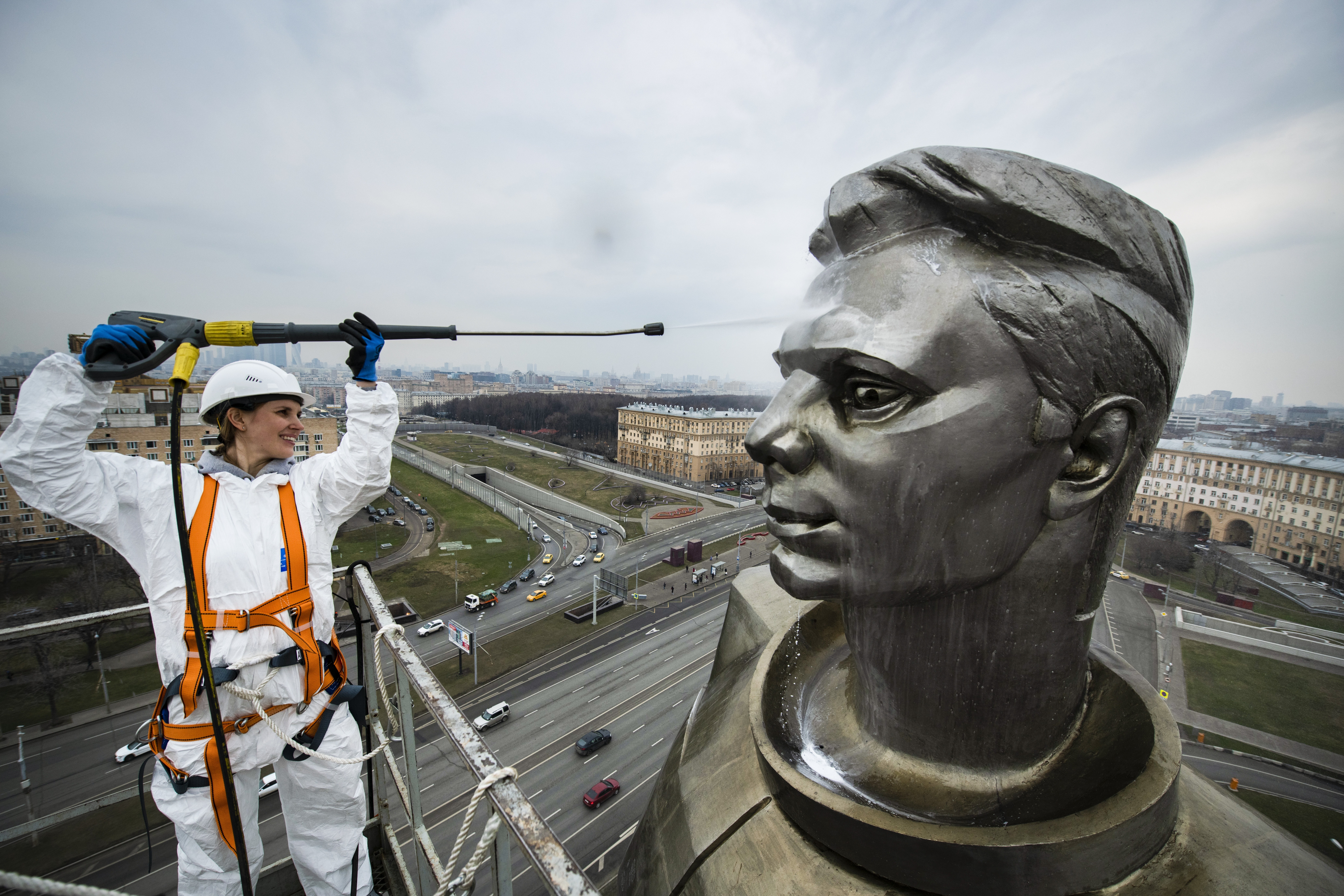 A worker cleans the statue of Yuri Gagarin, the first person who flew to space, ahead of Cosmonautics Day celebrated on April 12, in Moscow, Russia, Wednesday April 10, 2019. Cosmonautics Day marks when Soviet cosmonaut Yuri Gagarin became the first man to fly in space, in 1961, orbiting the earth once before making a safe landing. (AP Photo/Maxim Marmur)