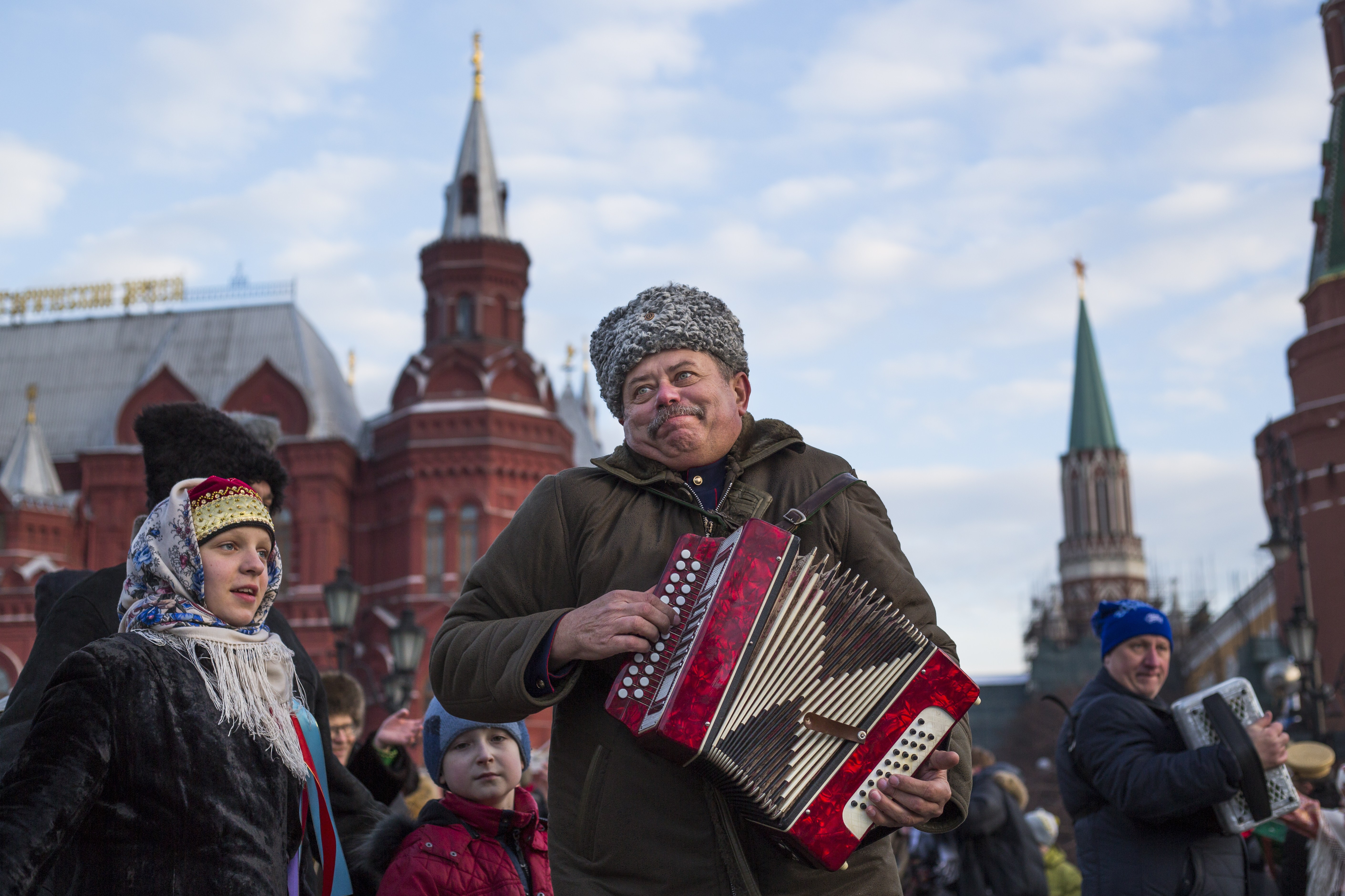 Men play accordions during a folk performance just off Red Square in Moscow, Russia, Wednesday, Feb. 24, 2016. (AP Photo/Alexander Zemlianichenko)