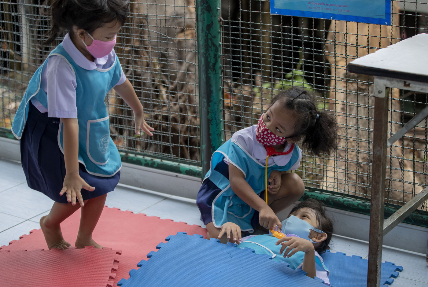 Children play at Makkasan preschool in Bangkok, Thailand, Wednesday, July 1, 2020. Thailand has begun a fifth phase of relaxations of COVID-19 restrictions, allowing the reopening of schools and high-risk entertainment venues such as pubs and massage parlors that had been shut since mid-March. (AP Photo/ Gemunu Amarasinghe)
