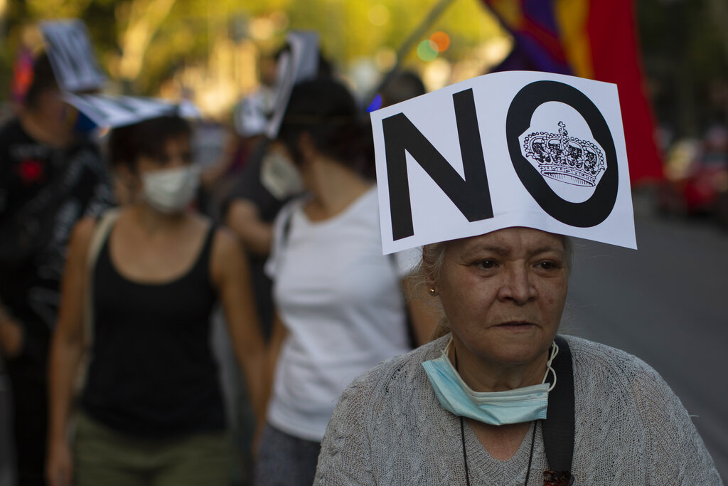 Demonstrators march during a protest against Spanish Monarchy in Madrid, Spain, Saturday, July 25, 2020.  A barrage of media leaks have revealed how the king's father, former monarch Juan Carlos I, allegedly hid millions of untaxed euros in offshore funds, prompting public protests. (AP Photo/Manu Fernandez)
