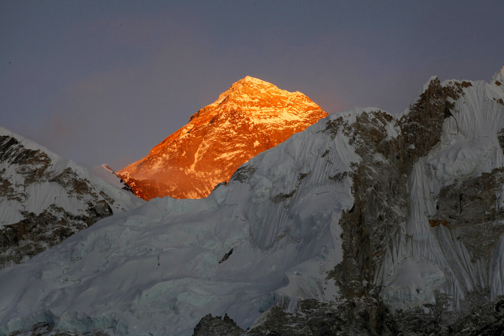 FILE - In this Nov. 12, 2015, file photo, Mt. Everest is seen from the way to Kalapatthar in Nepal. Nepal mountaineering authorities have determined that an Indian couple faked a Mount Everest ascent earlier this year by altering photographs to show they were on the summit. A Nepalese national has shattered the previous mountaineering record for successfully climbing the world’s 14 highest peaks, completing the feat in 189 days. (AP Photo/Tashi Sherpa, File)