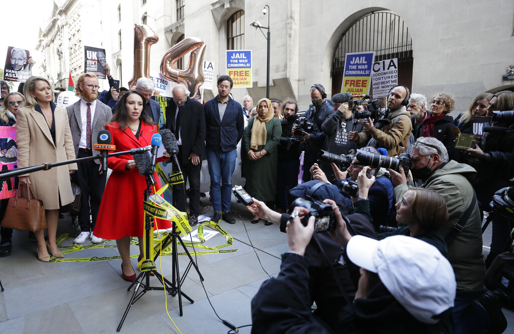 Stella Moris, partner of Julian Assange gives a statement outside the Old Bailey in London, Thursday, Oct. 1, 2020, as the Assange extradition hearing to the US ended, with a result expected later in the year. (AP Photo/Kirsty Wigglesworth)