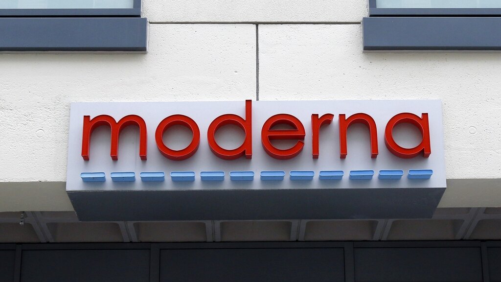 FILE - In this Monday, May 18, 2020, file photo, a sign marks an entrance to a Moderna, Inc., building, in Cambridge, Mass. Moderna Inc. says it will ask U.S. and European regulators to allow emergency use of its COVID-19 vaccine as new study results confirm the shots offer strong protection. (AP Photo/Bill Sikes, File)