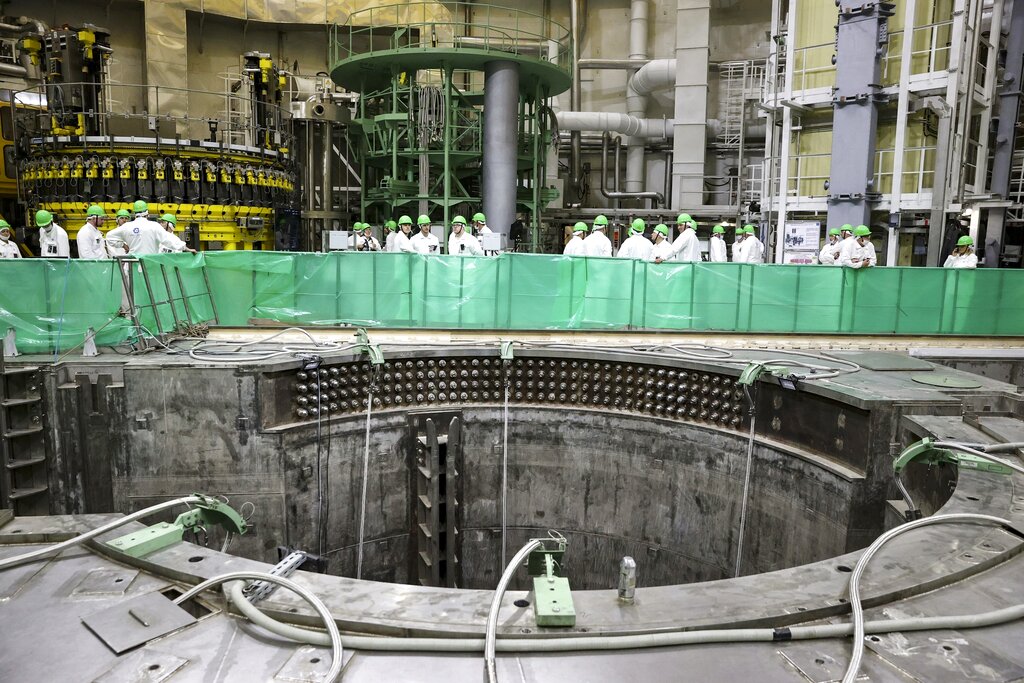 Personnel work to begin loading nuclear fuel at Belarus' first nuclear plant which was built by Russia's state nuclear corporation Rosatom, near Astravets, Belarus, Friday, Aug. 7, 2020. The plant in Astravets near the border has been built by Russia's state nuclear corporation Rosatom. Rosatom and Belarusian authorities have insisted that the 1,200-megawatt reactor is safe, but Lithuania has described the plant as a threat to the environment and public health. (Aksana Manchuk, BelTa, Pool Photo via AP)