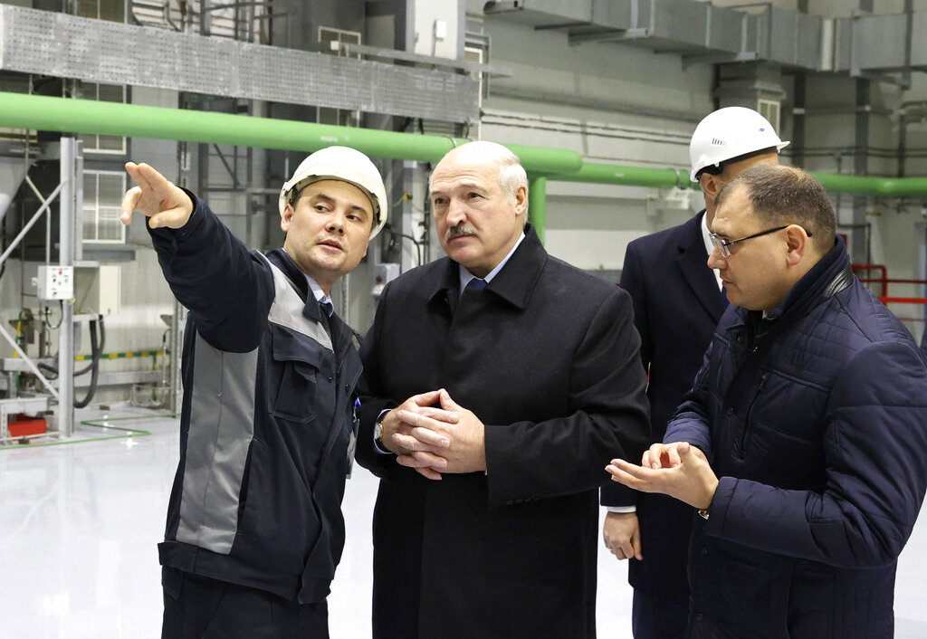 Belarusian President Alexander Lukashenko, centre, attends the first Belarusian Nuclear Power Plant during the plant's power launch event outside the city of Astravets, Belarus, Saturday, Nov. 7, 2020. Alexander Lukashenko on Saturday formally opened the country's first nuclear power plant, a project sharply criticized by neighboring Lithuania. Lukashenko said the launch of the Russian-built and -financed Astravyets plant 