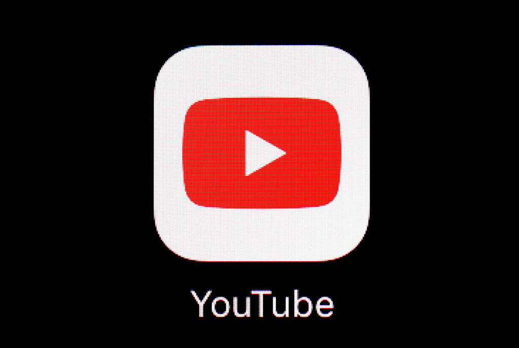 FILE - This March 20, 2018, file photo shows the YouTube app on an iPad. More than a month after the U.S. presidential election, YouTube says it will start removing newly uploaded material that claims widespread voter fraud or errors changed the outcome. The Google-owned video service said Wednesday, Dec. 9, 2020 that this is in line with how it has dealt with past elections. That’s because Tuesday was the “safe harbor” deadline for the election and YouTube said enough states have certified their results to determine Joe Biden as the winner.  (AP Photo/Patrick Semansky, File)