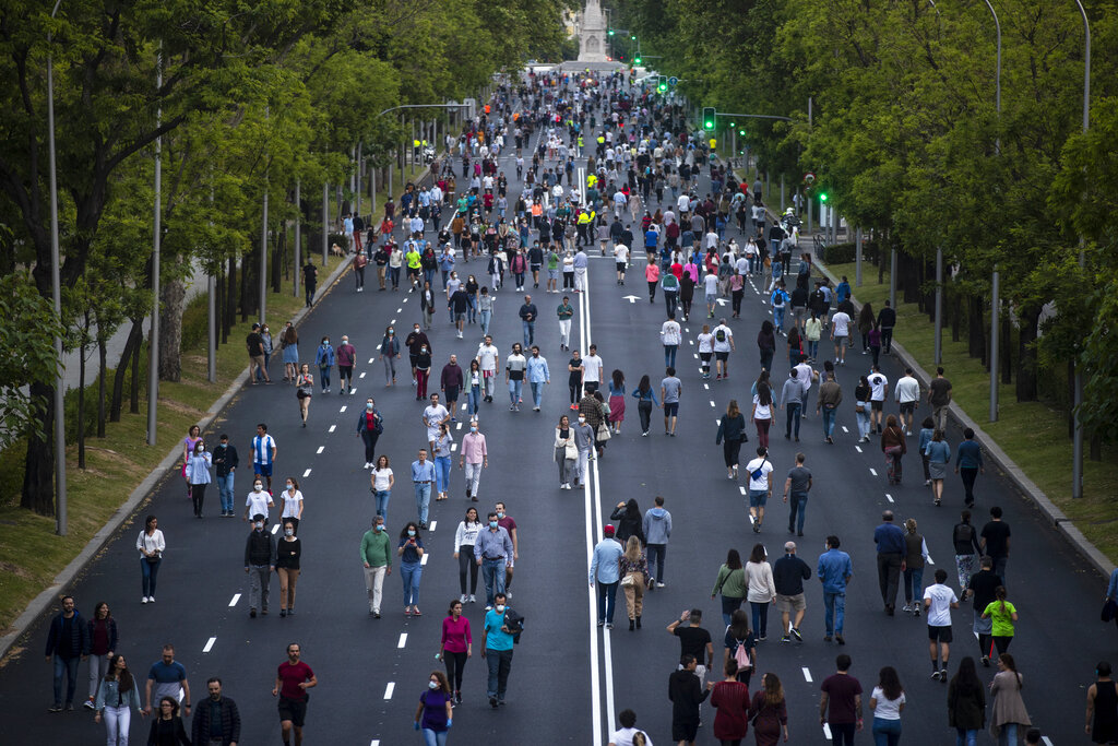 People exercise along the Paseo de la Castellana after a relaxation of the government's COVID-19 coronavirus lockdown measures in Madrid, Spain, Saturday, May 9, 2020. (AP Photo/Manu Fernandez)