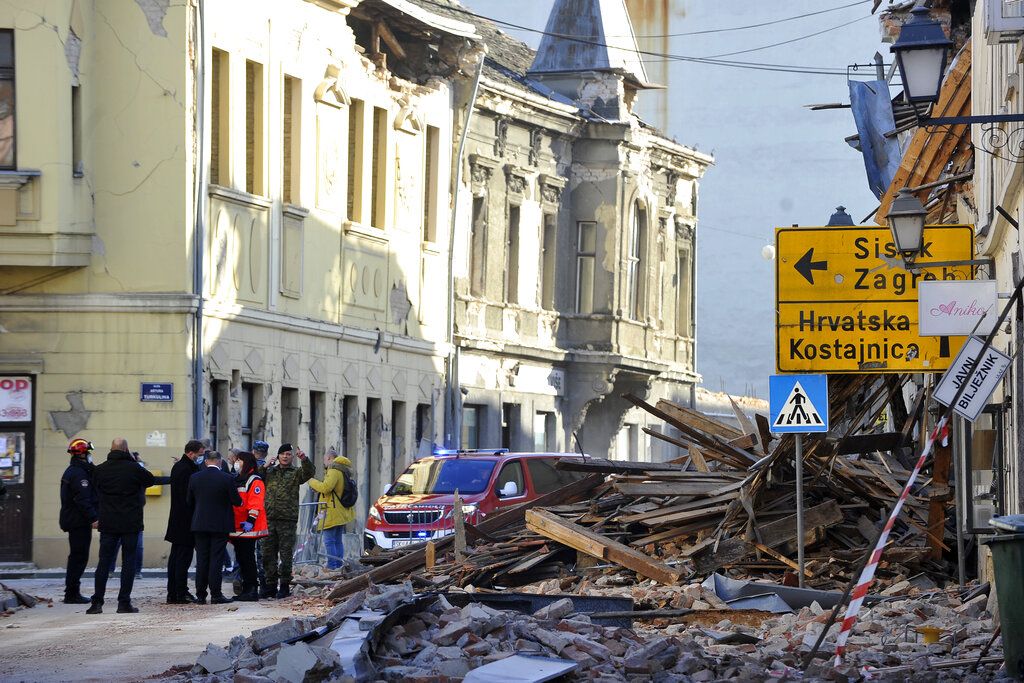 A street is covered by debris from buildings damaged in an earthquake in Petrinja, Croatia, Tuesday, Dec. 29, 2020. A strong earthquake has hit central Croatia and caused major damage and at least one death and 20 injuries in a town southeast of the capital Zagreb. (AP Photo)