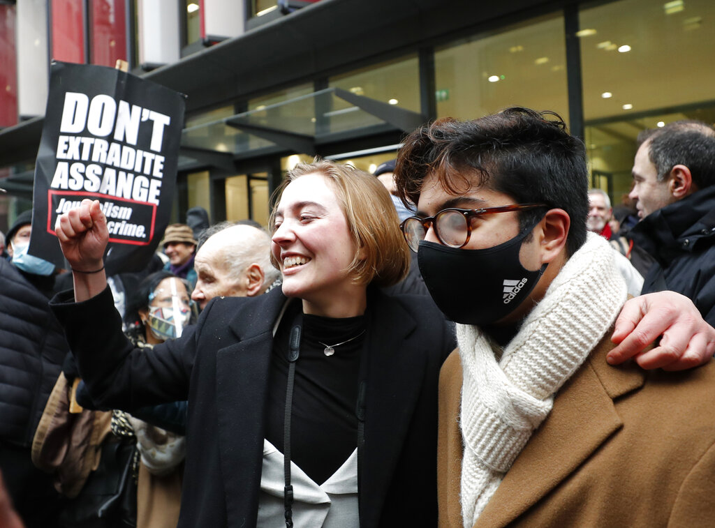Julian Assange supporters celebrate after a ruling that he cannot be extradited to the United States, outside the Old Bailey in London, Monday, Jan. 4, 2021. A British judge has rejected the United States' request to extradite WikiLeaks founder Julian Assange to face espionage charges, saying it would be 