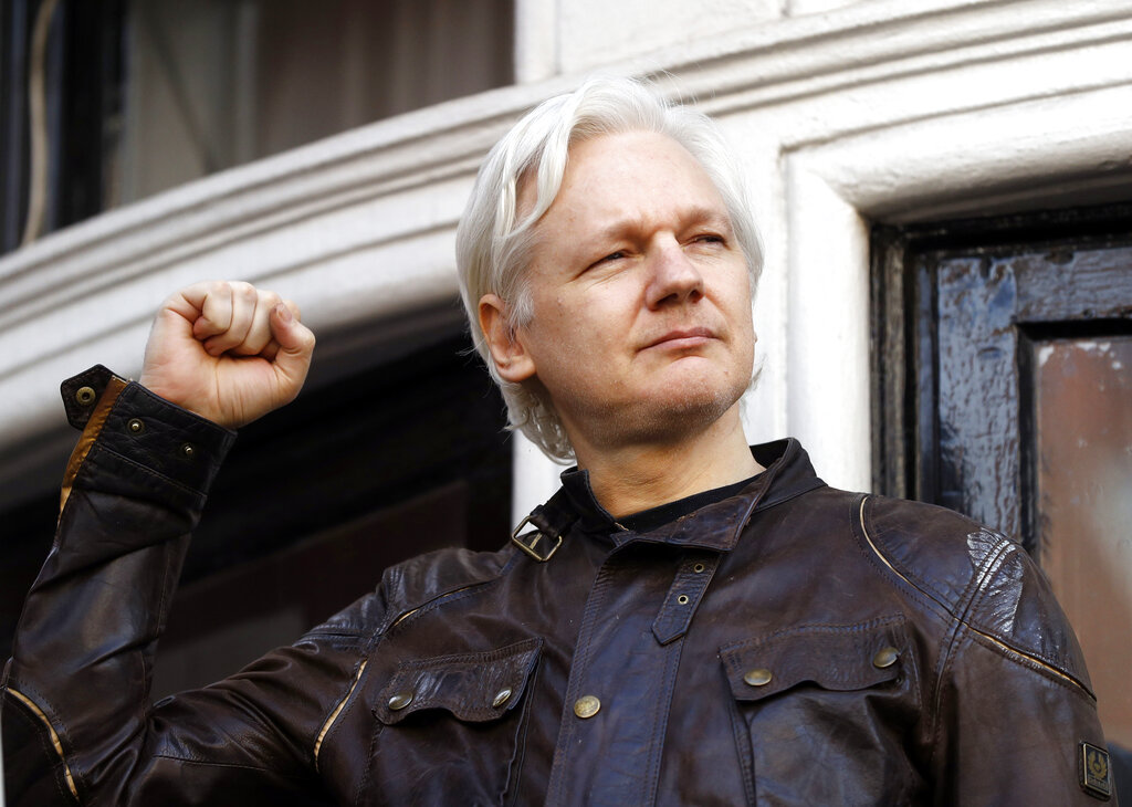 FILE - In this May 19, 2017 file photo, WikiLeaks founder Julian Assange greets supporters outside the Ecuadorian embassy in London, where he has been in self imposed exile since 2012.  Judge Vanessa Baraitser has ruled that Julian Assange cannot be extradited to the US. because of concerns about his mental health, it was reported on Monday, Jan. 4, 2021. Assange had been charged under the US’s 1917 Espionage Act for “unlawfully obtaining and disclosing classified documents related to the national defence”. (AP Photo/Frank Augstein, File)
