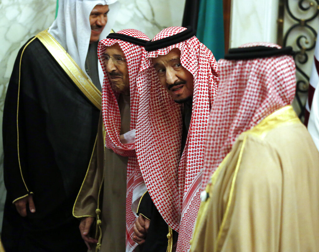 Saudi King Salman accompanies Kuwait's emir, Sheikh Sabah Al Ahmad Al Sabah, left, during the 40th Gulf Cooperation Council Summit in Riyadh, Saudi Arabia, Tuesday, Dec. 10, 2019.  (AP Photo/Amr Nabil)