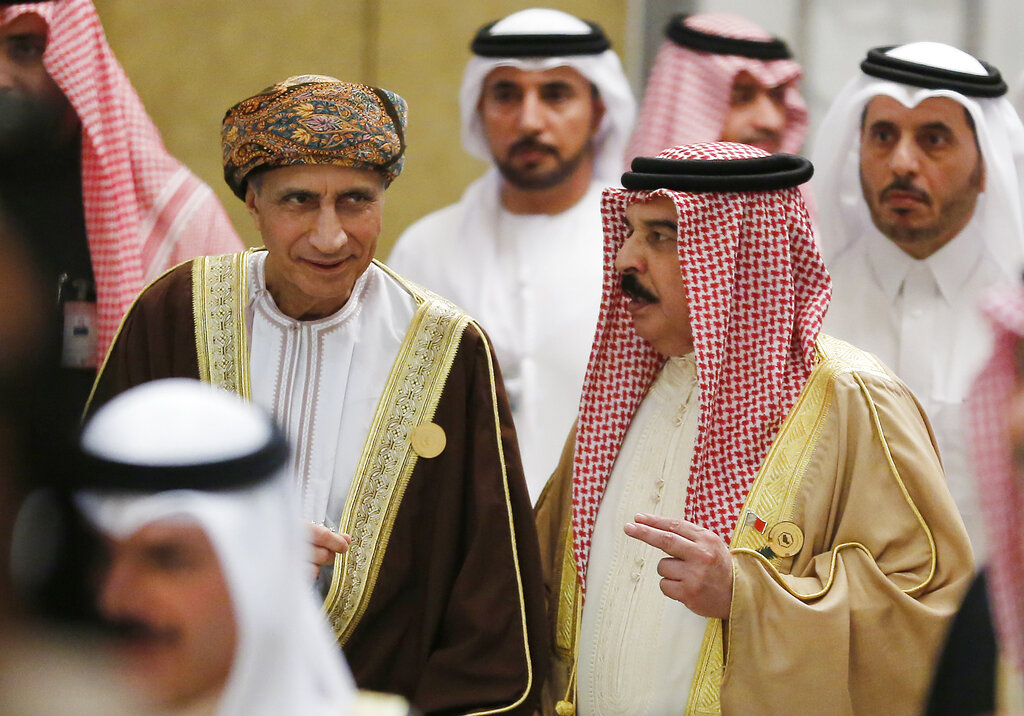 Bahrain's King Hamad bin Isa Al Khalifa, right, talks to Deputy Prime Minister of Oman Sayyid Fahd bin Mahmoud Al Said during the 40th Gulf Cooperation Council Summit in Riyadh, Saudi Arabia, Tuesday, Dec. 10, 2019.  (AP Photo/Amr Nabil)
