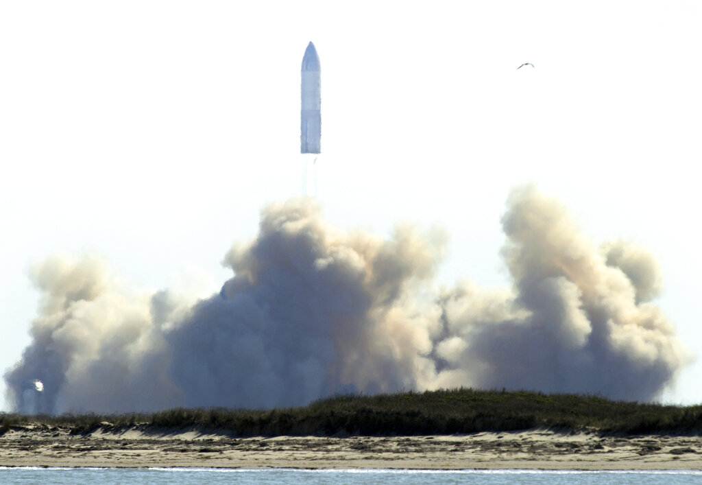 SpaceX's bullet-shaped Starship prototype lifts off for a successful test launch, Tuesday, Feb. 2, 2021, in Boca Chica, Texas. The test flight ended in a fiery crash when the Starship attempted to land. (Miguel Roberts/The Brownsville Herald via AP)