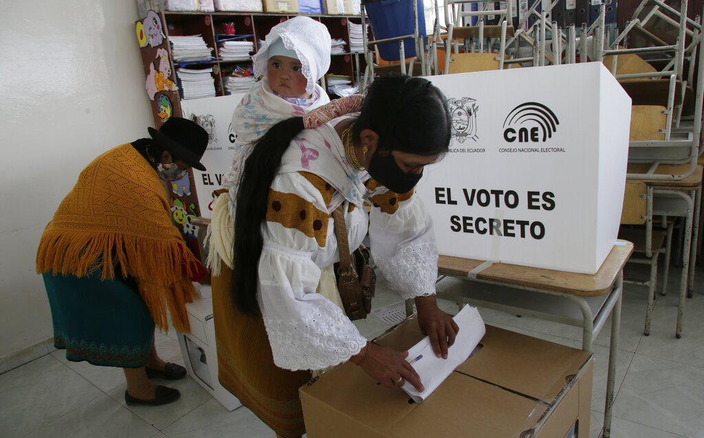 Women cast their ballots in Cangahua, Ecuador, Sunday, Feb. 7, 2021. Ecuadoreans went to the polls in first-round presidential legislative elections. (AP Photo/Dolores Ochoa)