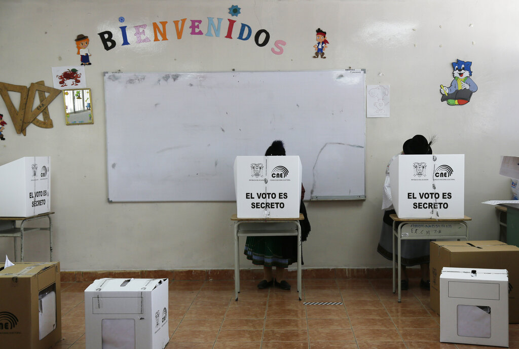 Women cast their ballots in Cangahua, Ecuador, Sunday, Feb. 7, 2021. Ecuadoreans went to the polls in first-round presidential and legislative elections. (AP Photo/Dolores Ochoa)