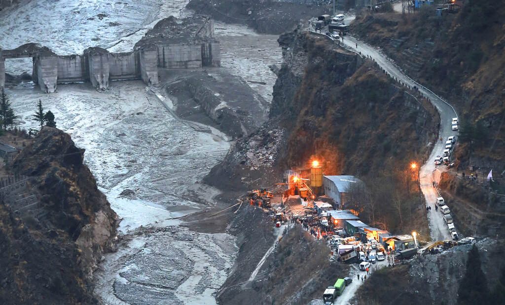 A aerial view of Tapovan barrage two days after a portion of the Nanda Devi glacier snapped off, releasing water trapped behind it in Tapovan, northern state of Uttarakhand, India, Tuesday, Feb.9, 2021. Scientists are investigating what caused the glacier to break — possibly an avalanche or a release of accumulated water. Experts say climate change may be to blame since warming temperatures are shrinking glaciers and making them unstable worldwide. (AP Photo)