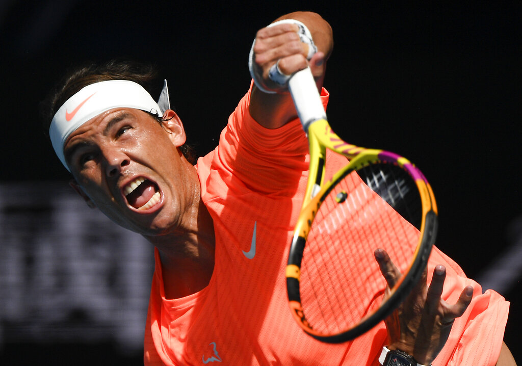 Spain's Rafael Nadal serves during his fourth round match against Italy's Fabio Fognini at the Australian Open tennis championship in Melbourne, Australia, Monday, Feb. 15, 2021.(AP Photo/Andy Brownbill)