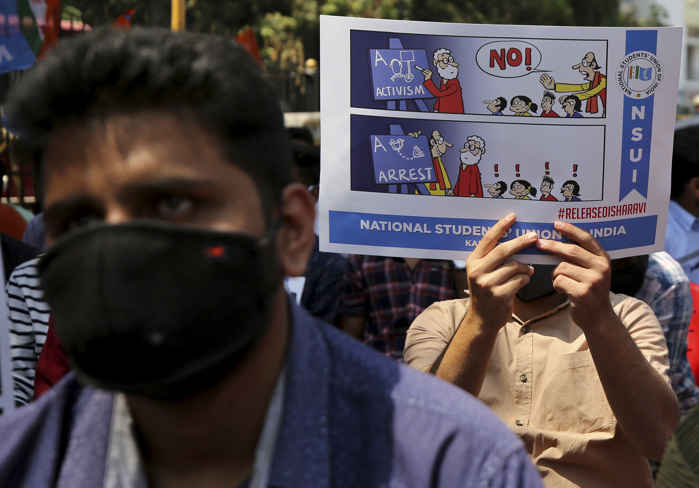 A students holds a placard demanding the release of Indian climate activist Disha Ravi, during a protest in Bengaluru, India, Tuesday, Feb.16 2021. Ravi, 22, was arrested in Bengaluru Saturday for circulating a document on social media supporting months of massive protests by farmers. Police said that the document spread misinformation about the farmer protests on the outskirts of New Delhi and "tarnished the image of India." (AP Photo/Aijaz Rahi)