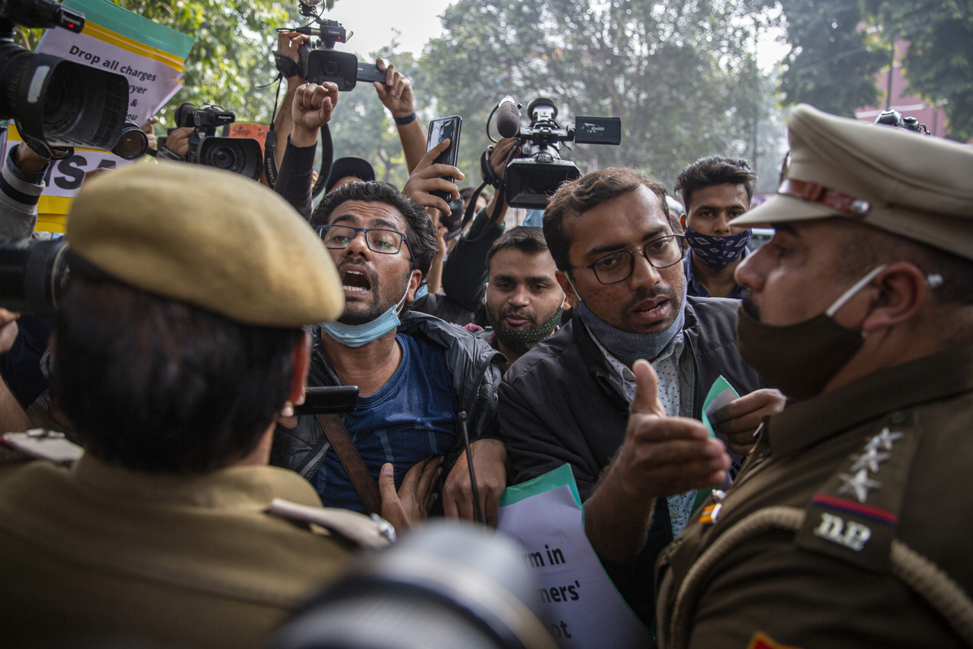 Police try to stop students protesting against the police action against various activists in New Delhi, India, Tuesday, Feb. 16, 2021. Police on Saturday arrested climate activist Disha Ravi, for circulating a document on social media supporting months of massive protests by farmers. Police also issued arrest warrants for two other activists, Nikita Jacob and Shantanu Muluk, saying the three created the document and shared it with others. According to police, the sharing of the document on social media indicated there was a “conspiracy” behind violence on Jan. 26, India's Republic Day, when the largely peaceful farmer protests erupted into clashes with police. (AP Photo/Altaf Qadri)