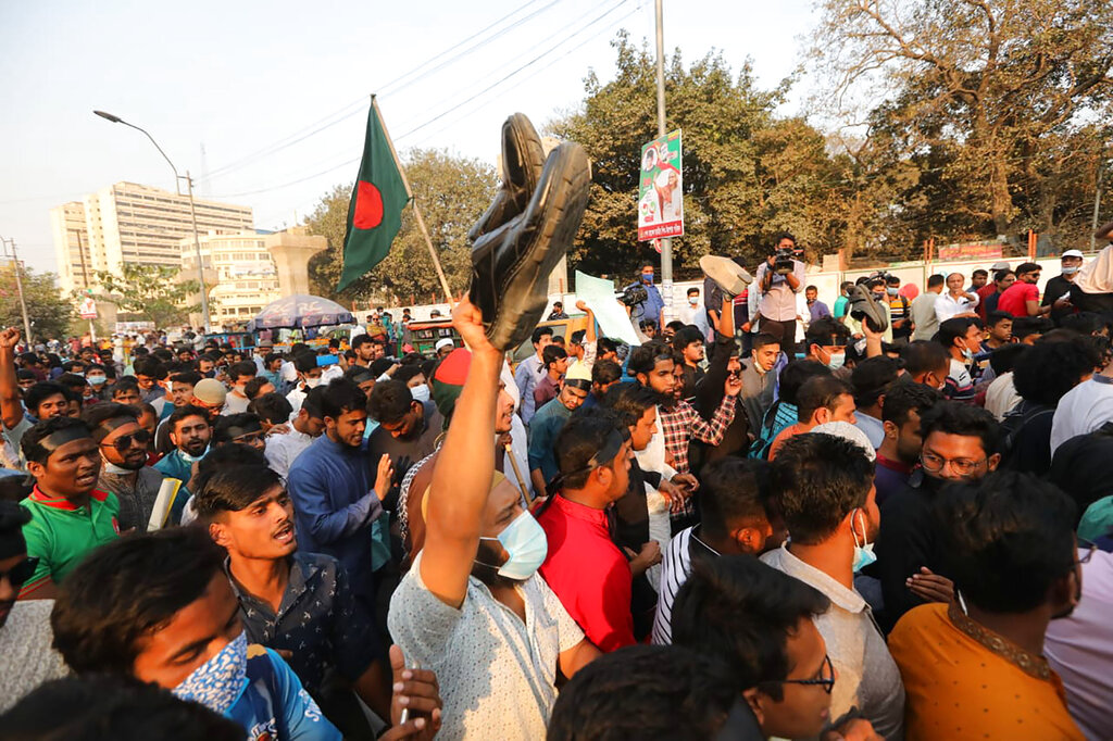 Protesters shout slogans as they protest the death in prison of a writer who was arrested on charges of violating the sweeping digital security, in Dhaka, Bangladesh, Friday, Feb. 26, 2021. Mushtaq Ahmed, 53, was arrested in Dhaka in May last year for making comments on social media that criticized the Prime Minister Sheikh Hasina government's handling of the coronavirus pandemic. He had been denied bail at least six times. (AP Photo/Mahmud Hossain Opu)