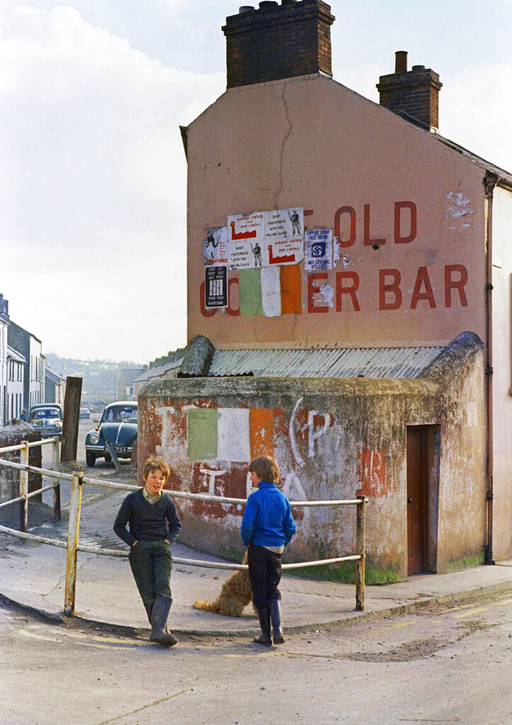 Kids stand around outside a pub on a street in Belfast, capital of Northern Ireland, shown Feb. 1972. (AP Photo/Michel Laurent)