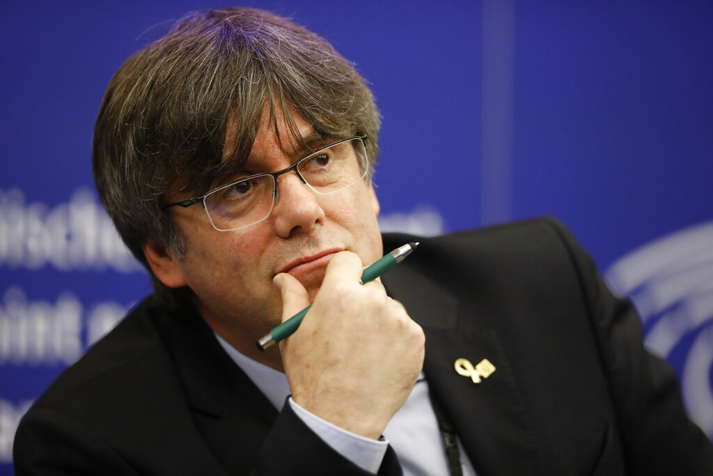 FILE - In this Monday Jan. 13, 2020 file photo, Catalan leader Carles Puigdemont reacts during a press conference at the European Parliament in Strasbourg, eastern France. Catalonia’s former regional president Carles Puigdemont says that he will continue to fight extradition back to Spain if, as he expects, the European Union Parliament strips him of his immunity as a continental lawmaker this week. On Monday March 8, 2021, Puigdemont, along with cohorts Toni Comín and Clara Ponsatí, face a vote by the European Parliament to lift their immunity as lawmakers as has been recommended by the parliament’s Legal Affairs Committee. (AP Photo/Jean-Francois Badias, File)