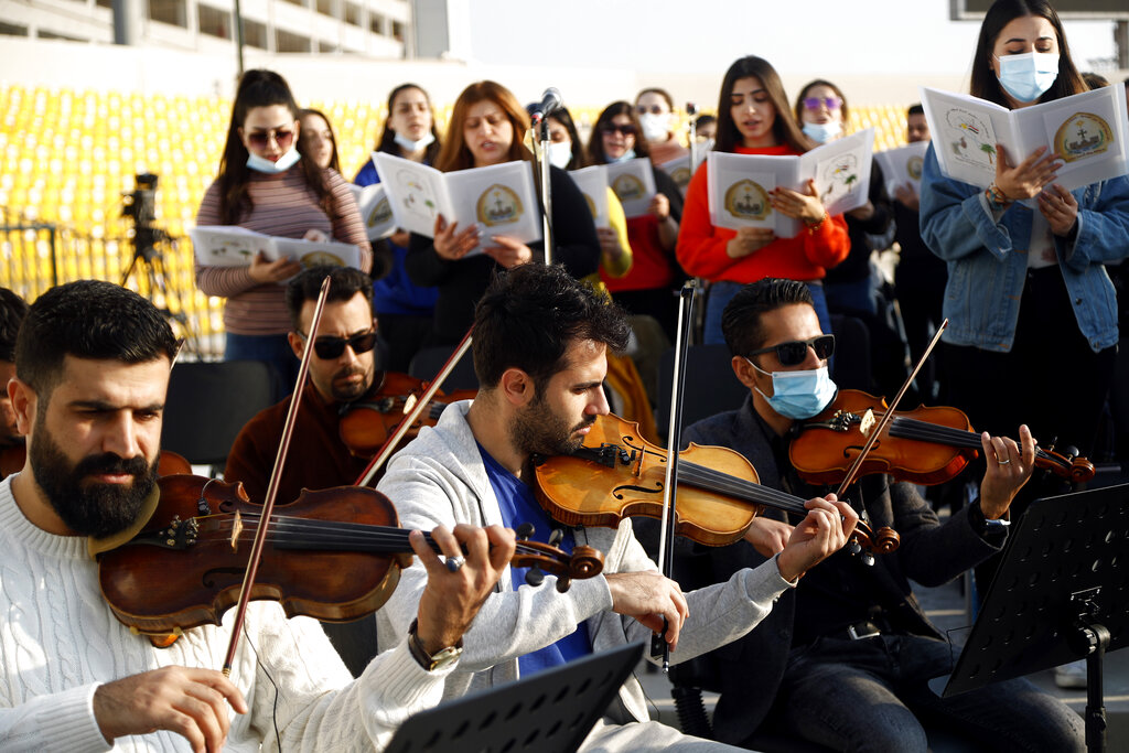 Kurdish symphony band practices before Pope Francis visit to Iraq at the main stadium in Irbil, Iraq, Saturday, March 6, 2021. Earlier today Pope Francis met privately with the country's revered Shiite leader, Grand Ayatollah Ali al-Sistani. (AP Photo/Hadi Mizban)