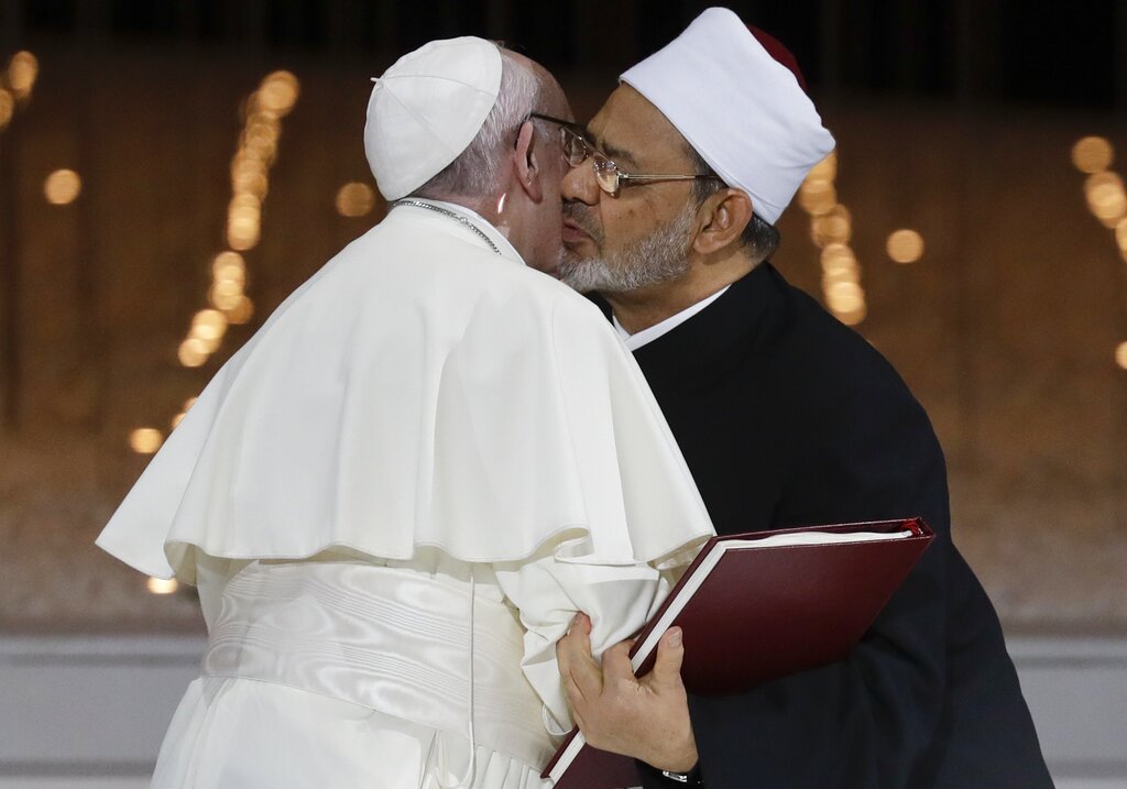 Pope Francis hugs Sheikh Ahmed el-Tayeb, the grand imam of Egypt's Al-Azhar, after an Interreligious meeting at the Founder's Memorial in Abu Dhabi, United Arab Emirates, Monday, Feb. 4, 2019. Pope Francis has asserted in the first-ever papal visit to the Arabian Peninsula that religious leaders have a duty to reject all war and commit themselves to dialogue. (AP Photo/Andrew Medichini)