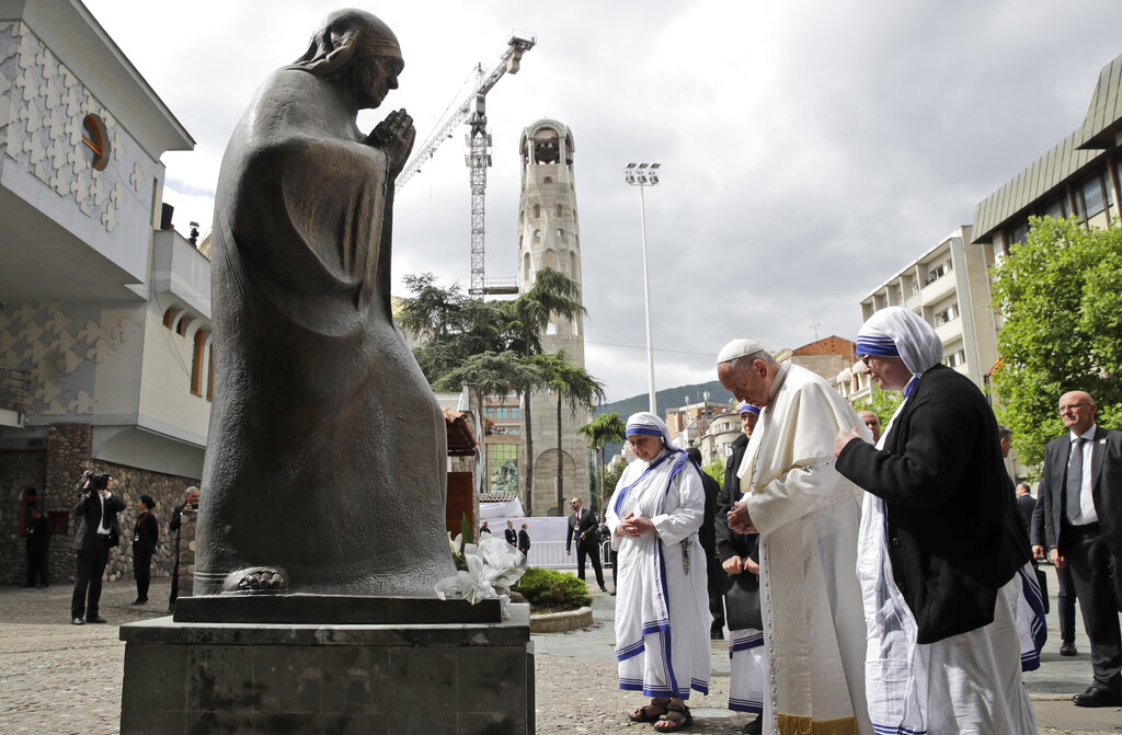 Pope Francis prays in front of a statue of Mother Teresa at her memorial in Skopje, North Macedonia, Tuesday, May 7, 2019. Francis, who is on a three-day trip to the Balkans, is visiting North Macedonia for the first-ever papal visit to the country. (AP Photo/Alessandra Tarantino)