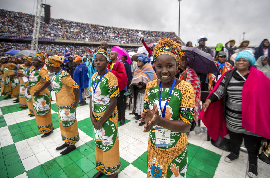 Women sing and dance during a Mass celebrated by Pope Francis at the Zimpeto stadium, on the outskirts of the capital Maputo, Mozambique Friday, Sept. 6, 2019. Pope Francis wrapped up his visit to Mozambique on Friday by consoling HIV-infected mothers and children and denouncing the rampant corruption that has helped make the southern African nation one of the world's poorest countries. (AP Photo/Ben Curtis)