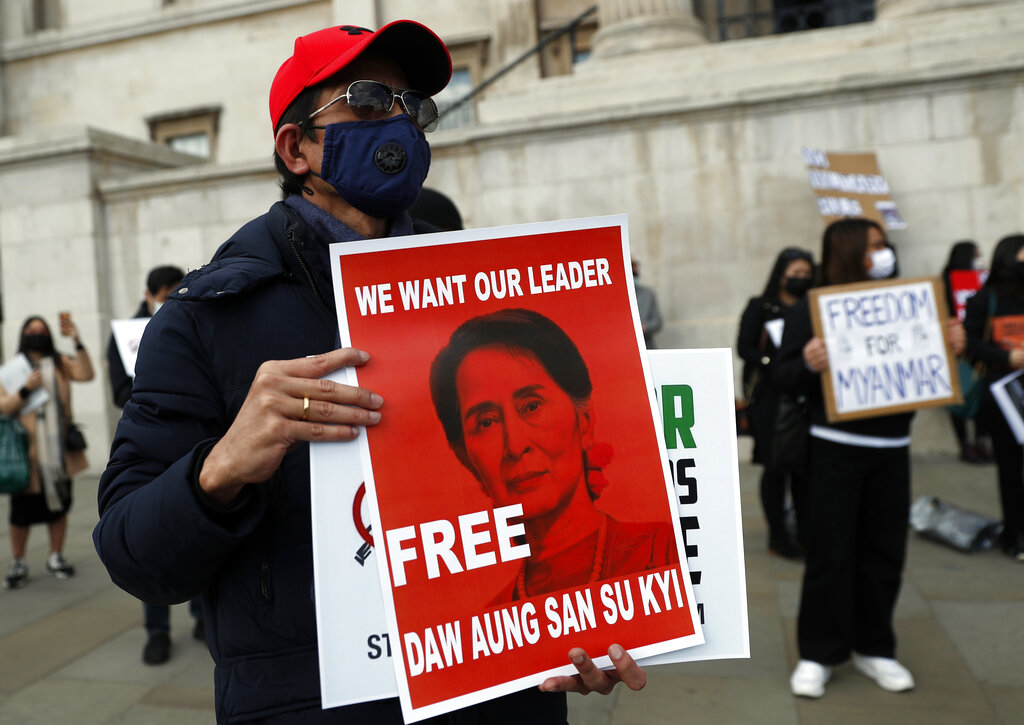 Supporters of ousted Myanmar leader Aung San Suu Kyi hold up placards during a demonstration against the coup led by Junta chief Senior Gen. Min Aung Hlaing, in London, Saturday, March 27, 2021. (AP Photo/Alastair Grant)