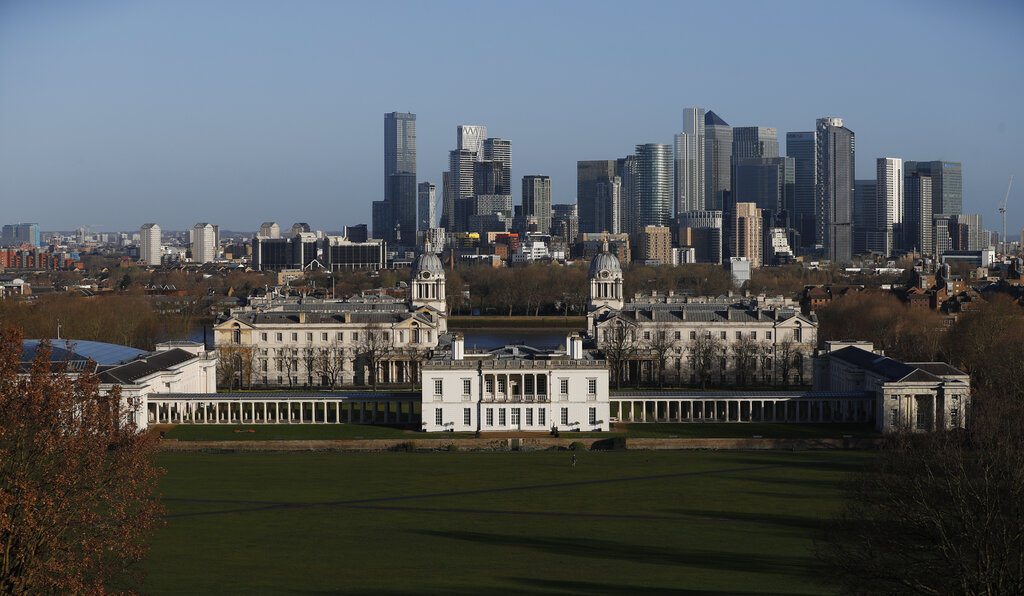 A general view over London from the Greenwich Observatory, with Canary Wharf at center rear, and the Queen's House at center in London, Saturday, March 27, 2021. (AP Photo/Alastair Grant)