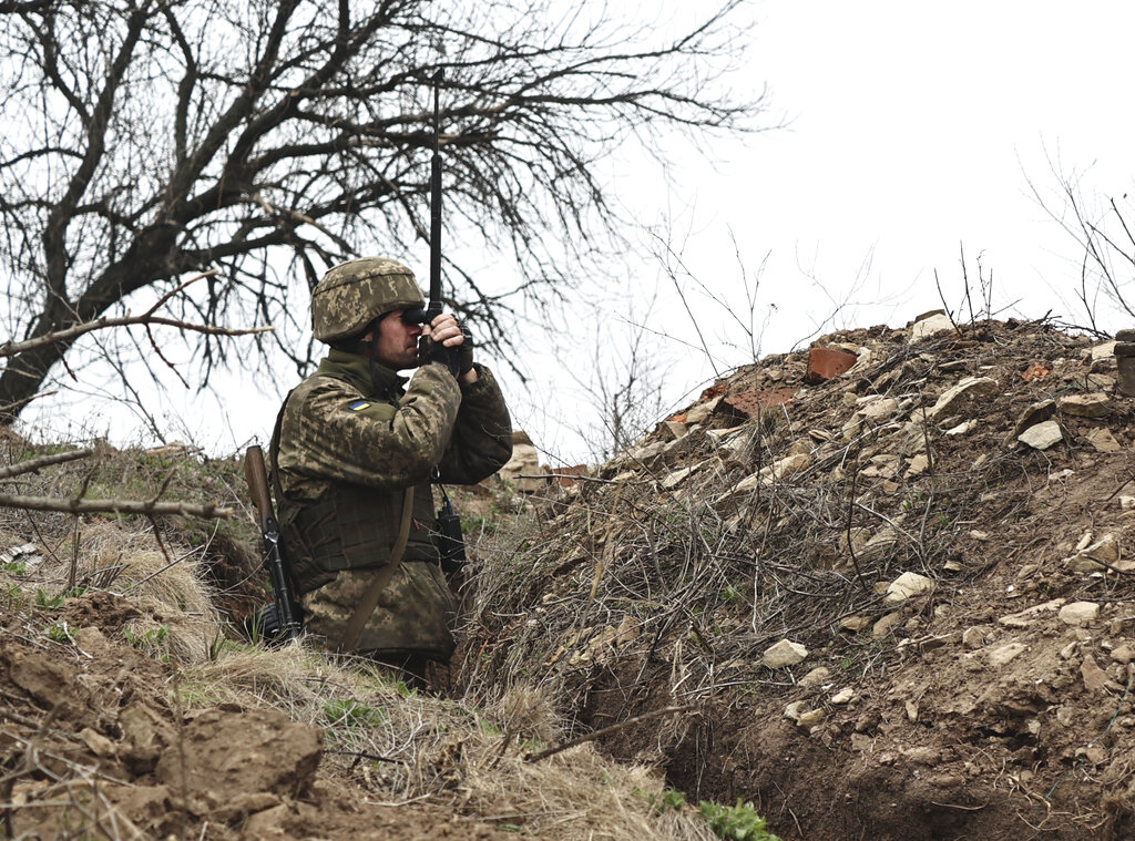 A Ukrainian soldier is seen at fighting positions on the line of separation from pro-Russian rebels near Donetsk, Ukraine, Monday, April 12, 2021. Ukraine's President Volodymyr Zelenskyy has requested to speak to Russian President Vladimir Putin about the Russian troop buildup along the Russian-Ukrainian border and the rising tensions in eastern Ukraine. But the request has been left unanswered so far, Zelenskyy's spokeswoman told The Associated Press on Monday. (AP Photo)