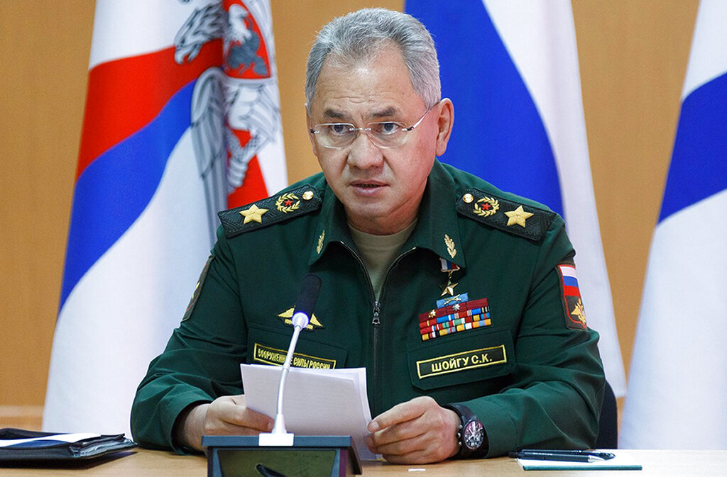 In this handout photo released by Russian Defense Ministry Press Service, Russian Defense Minister Sergei Shoigu speaks as he visits a naval base in in Gadzhiyevo, Russia, Tuesday, April 13, 2021. Shoigu on Tuesday described a massive military buildup in western Russia as part of drills intended to check the armed forces' readiness amid the threats posed by NATO. (Vadim Savitsky/Russian Defense Ministry Press Service via AP)