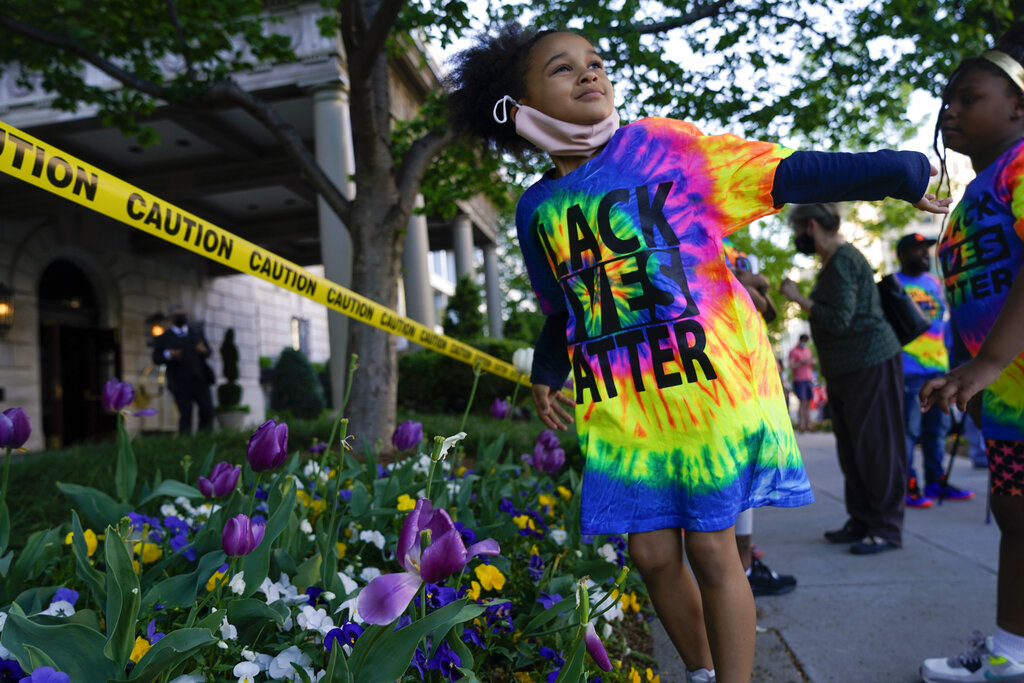 Mahkhyieah Lee, 5, of Scranton, Pa., dances at Black Lives Matter Plaza near the White House on Tuesday, April 20, 2021, in Washington, after the verdict in Minneapolis, in the murder trial against former Minneapolis police officer Derek Chauvin was announced. (AP Photo/Jacquelyn Martin)