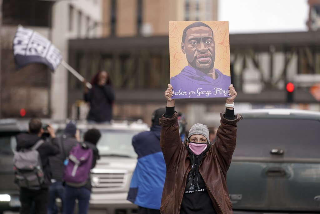 People celebrate outside the courthouse in Minneapolis, Tuesday, April 20, 2021, after the guilty verdicts were announced in the murder trial of former Minneapolis police Officer Derek Chauvin in the killing of George Floyd. (AP Photo/Morry Gash)
