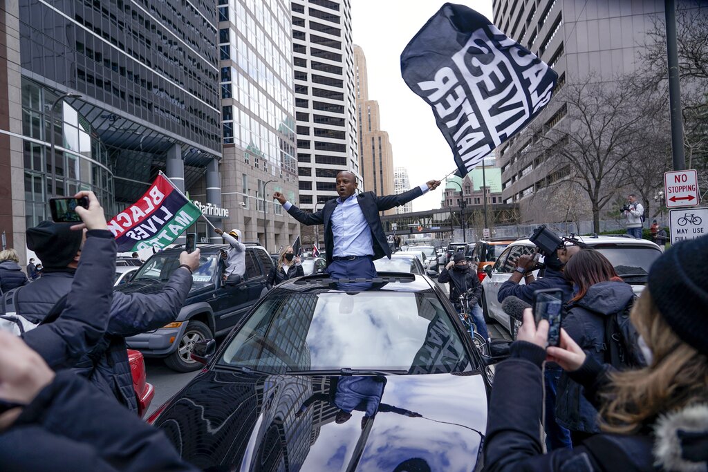 People rally outside the courthouse in Minneapolis on Tuesday, April 20, 2021, after the guilty verdicts were announced in the trial of former Minneapolis police officer Derek Chauvin in the death of George Floyd. (AP Photo/Morry Gash)