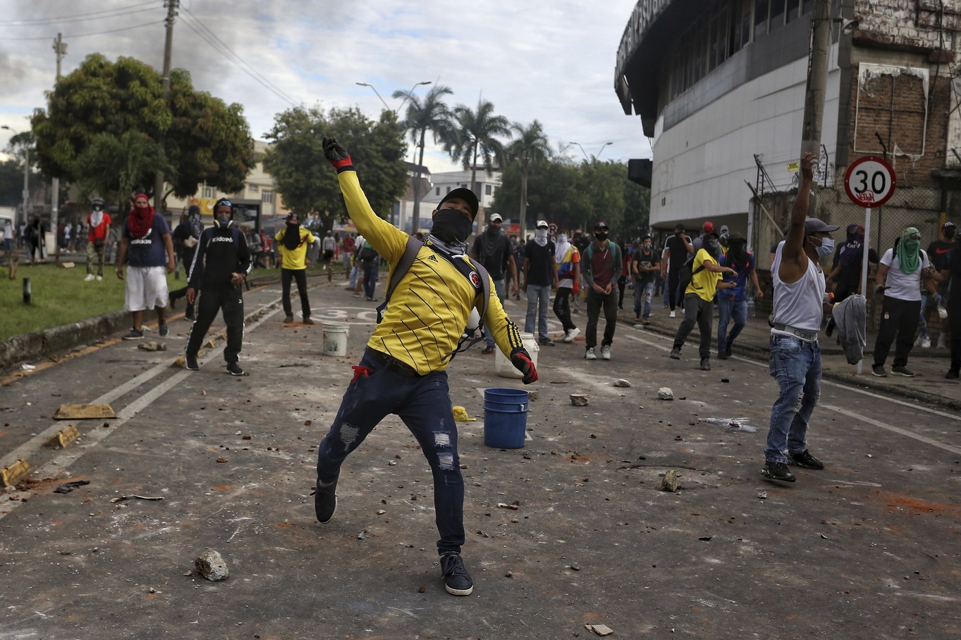 Protesters clash with police during a national strike against tax reform in Cali, Colombia, Monday, May 3, 2021. Colombia's President Ivan Duque withdrew the government-proposed tax reform on Sunday. (AP Photo/Andres Gonzalez)