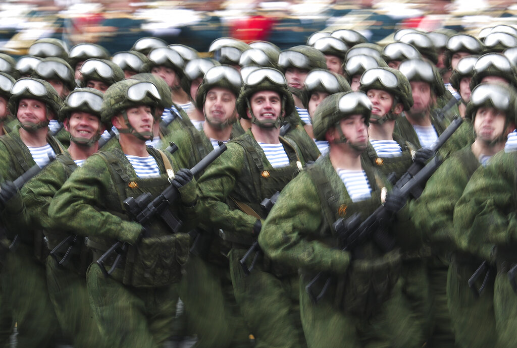 In this photo taken with long time exposure, Russian paratroopers march toward Red Square during the Victory Day military parade in Moscow, Russia, Sunday, May 9, 2021, marking the 76th anniversary of the end of World War II in Europe. (AP Photo)