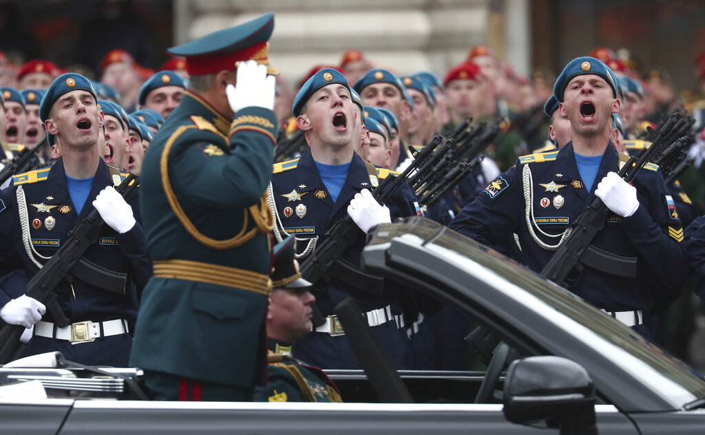 Russian Defense Minister Sergei Shoigu salutes to his soldiers as he is driven along Red Square in the Aurus Senat car during the Victory Day military parade in Moscow, Russia, Sunday, May 9, 2021, marking the 76th anniversary of the end of World War II in Europe. (AP Photo)