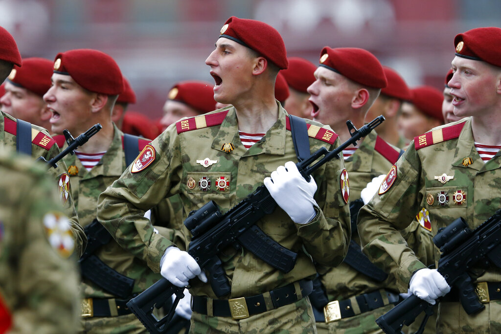 Russian Rosguardia (National Guard) soldiers march during the Victory Day military parade in Red Square in Moscow, Russia, Sunday, May 9, 2021, marking the 76th anniversary of the end of World War II in Europe. Russian President Vladimir Putin marked the anniversary of the end of World War II in Europe with a speech warning that Nazi beliefs remain strong. (AP Photo/Alexander Zemlianichenko)