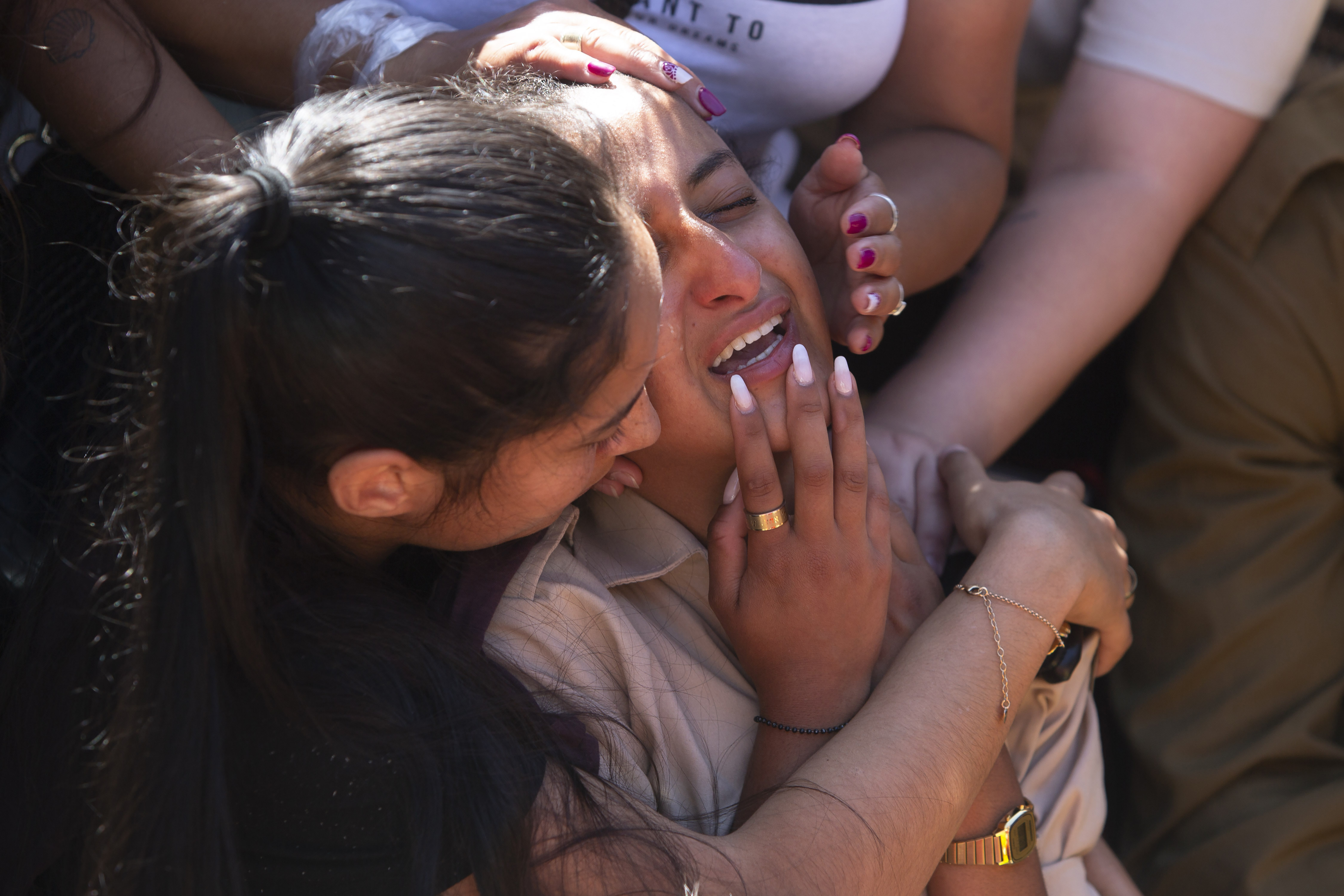 Friends and relatives of Israeli soldier Omer Tabib, 21, mourn during his funeral at the cemetery in the northern Israeli town of Elyakim, Thursday, May 13, 2021. The Israeli army confirmed that Tabib was killed in an anti-tank missile attack near the Gaza Strip, the first Israeli military death in the current fighting between Israelis and Palestinians. (AP Photo/Sebastian Scheiner)