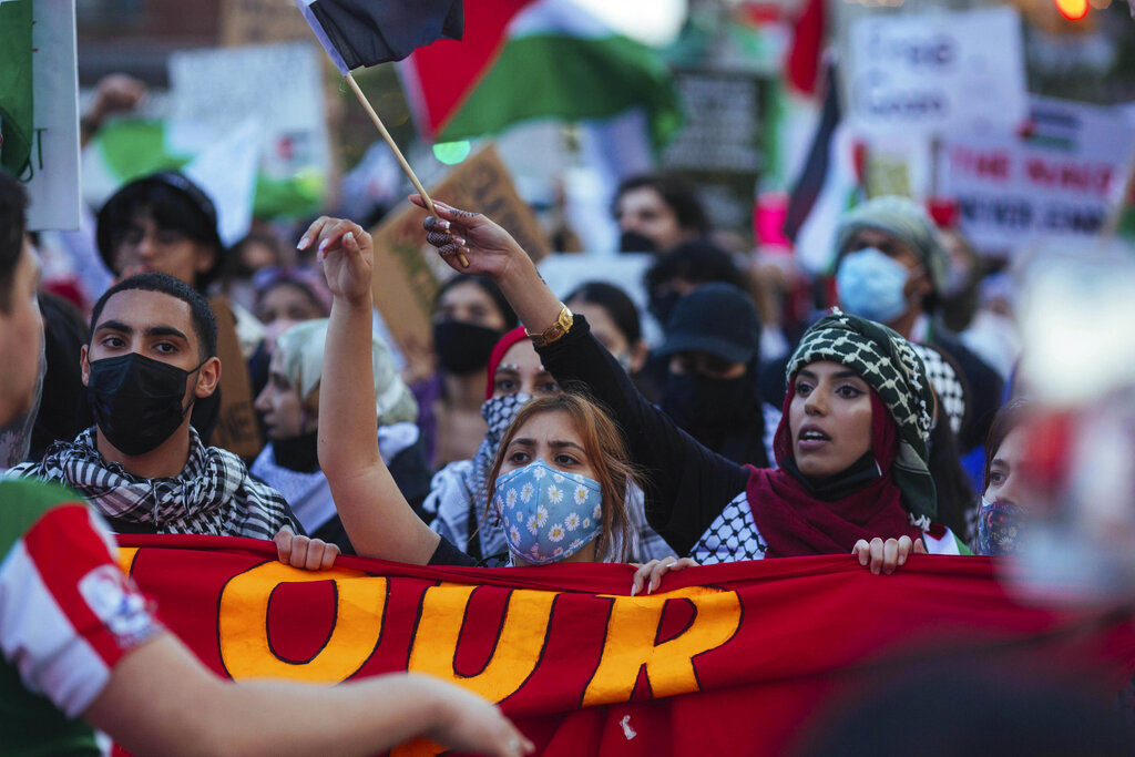 Thousands of activists supporting Palestine march during a rally Saturday, May 15, 2021, in New York. The rally supports Palestine in the ongoing conflict between Israel and Palestine on the day Israeli airstrikes leveled several buildings in the Gaza strip. (AP Photo/Kevin Hagen)