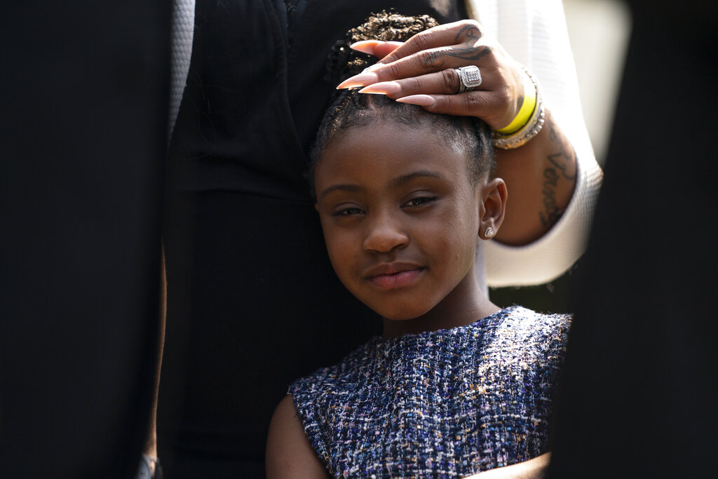 Gianna Floyd, the daughter of George Floyd, listens as members of the Floyd family speak with reporters after meeting with President Joe Biden at the White House, Tuesday, May 25, 2021, in Washington. (AP Photo/Evan Vucci)
