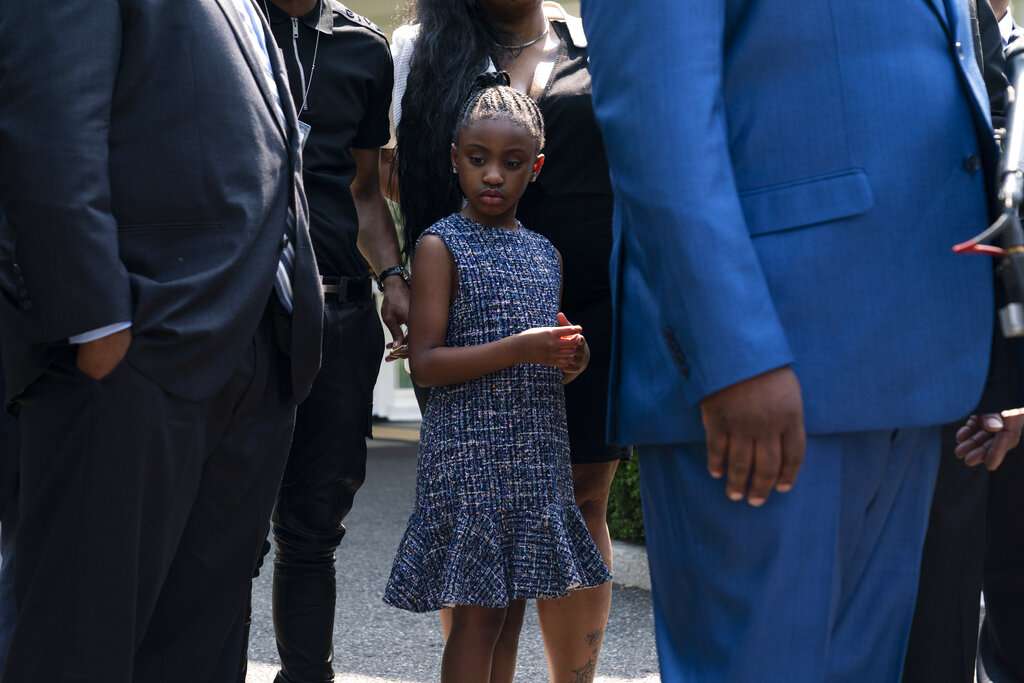 Gianna Floyd, the daughter of George Floyd, listens as members of the Floyd family speak with reporters after meeting with President Joe Biden at the White House, Tuesday, May 25, 2021, in Washington. (AP Photo/Evan Vucci)