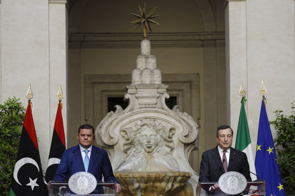 Italian Prime Minister Mario Draghi, right, and Libyan Prime Minister Abdulhamid Dbeibeh deliver their statements at the end of their meeting at Chigi palace, Premier's office, in Rome, Monday, May 31, 2021. (AP Photo/Gregorio Borgia, Pool)