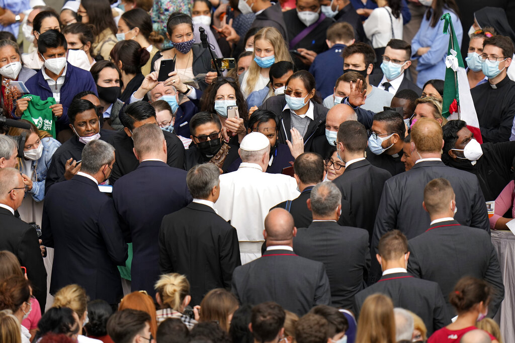 Pope Francis is greeted by faithful as he arrives for his weekly general audience, at the Vatican, Wednesday, June 9, 2021. (AP Photo/Alessandra Tarantino)